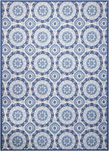 Close-up of Waverly Sun N' Shade Navy rug. Coastal style with blue floral medallion pattern on a light background.