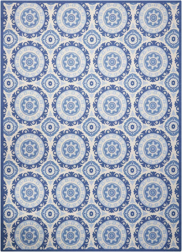Close-up of Waverly Sun N' Shade Navy rug. Coastal style with blue floral medallion pattern on a light background.