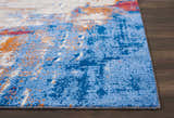 Close up of Nourison Twilight Ivory Multicolor Rug showing blue, orange, and white abstract pattern.