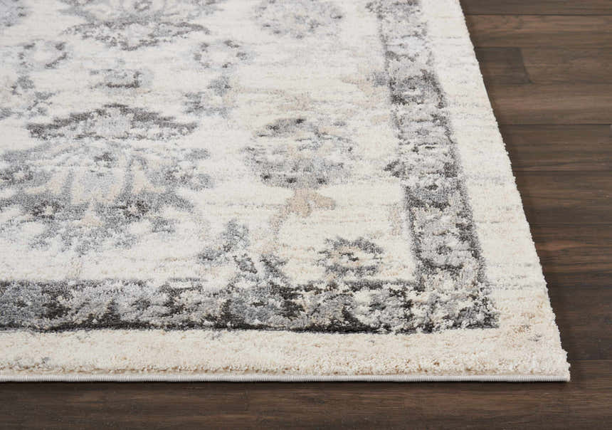 Close-up of the Nourison Fusion Cream Gray Vintage Area Rug showing its texture and pattern.