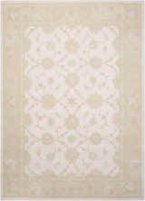Close-up of the Nourison Zephyr Ivory/Green Area Rug. Floral pattern with chestnut accents and handmade wool texture.