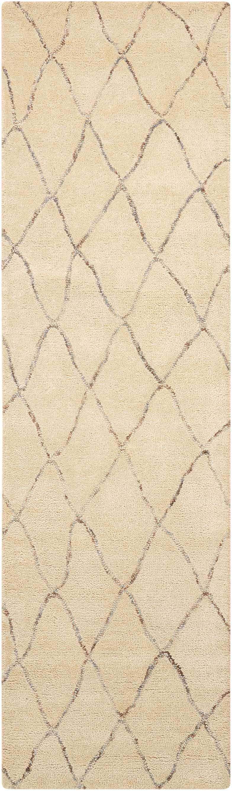 Close-up of Barclay Butera Intermix Sand rug. Handmade wool rug with a diamond trellis pattern and textured pile.