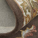 Close up of the Feizy Prescott rug showing the brown, ivory, and tan traditional floral pattern. Fold