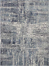 Close-up of the Nourison Urban Decor Slate/Ivory rug, featuring a modern, abstract pattern in shades of blue and ivory.