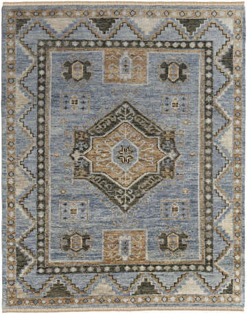 Close-up of Feizy Fillmore Traditional Medallion Area Rug. Blue, green, beige, and black tones in a vintage hand-knotted wool design. Design-Rectangle