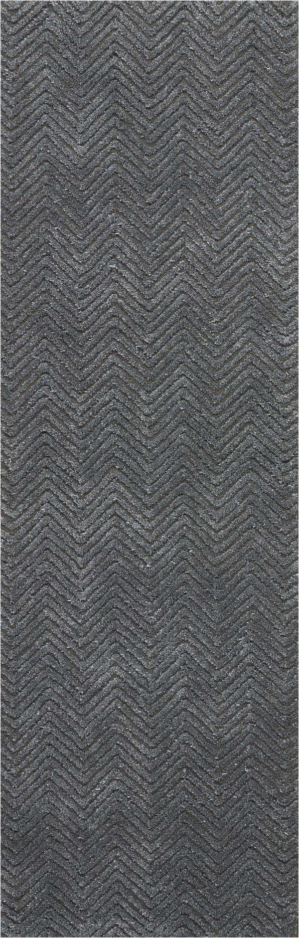 Close-up of the Nourison Deco Mod Grey rug, featuring a textured chevron pattern in shades of charcoal and silver.