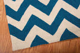 Close up of the Nourison Portico Navy Colorful Area Rug with a bold chevron pattern.