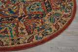 Close up of round Nourison 2020 Terracotta rug showing traditional floral pattern in burnt orange, teal, and gold.