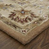 Close up of the Feizy Prescott Tan/Ivory Area Rug showing floral pattern and hand tufted texture. Corner