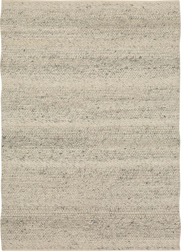 Close-up of the hand-loomed Karastan Zaza Ivory Area Rug, showing its dim gray and ivory wool texture and casual style. Design-Rectangle