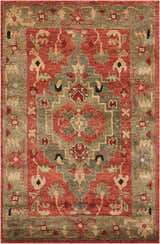 Close-up of the Nourison Tahoe Rust rug showcasing its traditional floral pattern in rust, green, and beige wool.