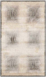 Close-up of Nourison Utopia Shell rug. Modern design with shell and gray geometric pattern. Soft texture.