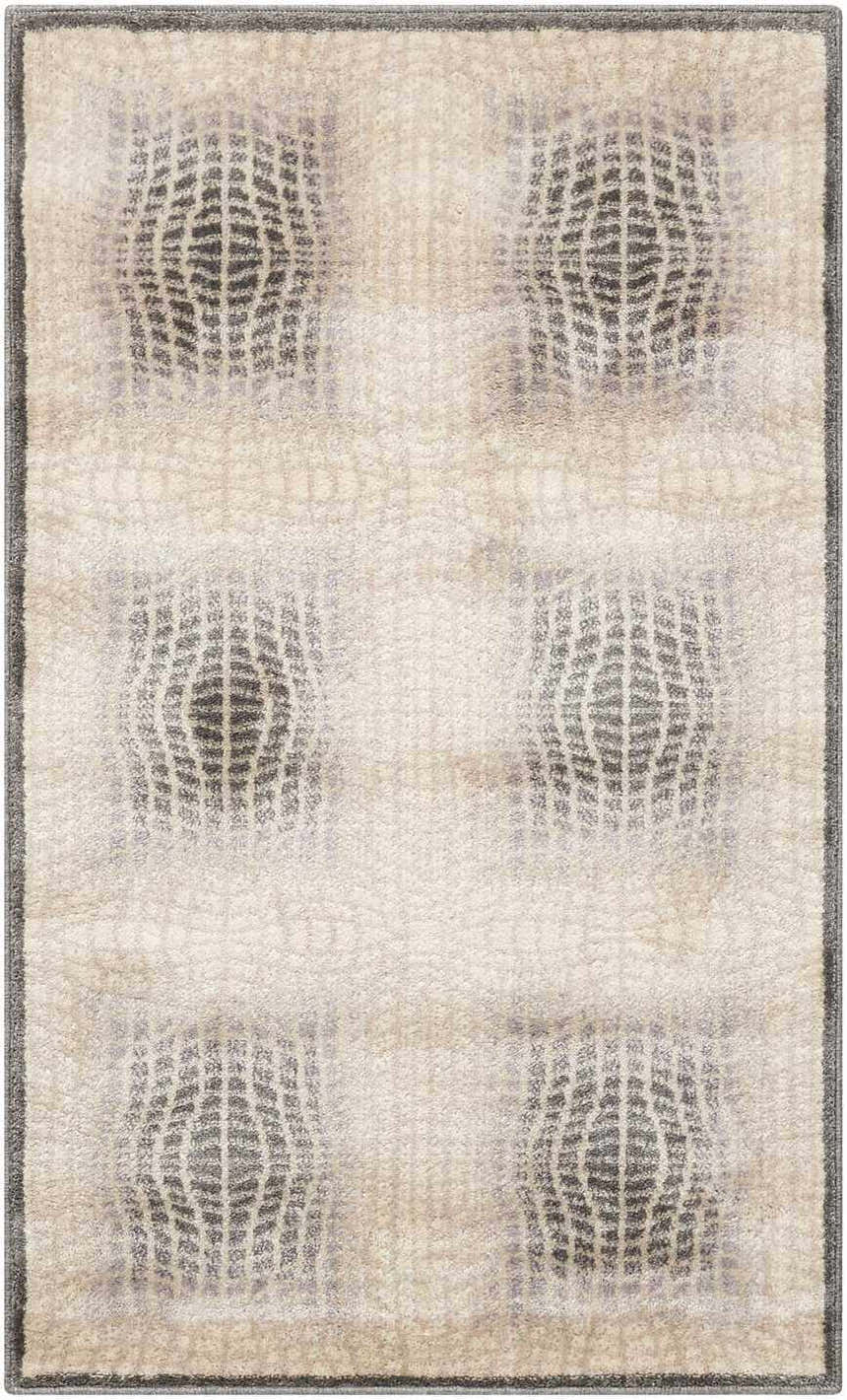Close-up of Nourison Utopia Shell rug. Modern design with shell and gray geometric pattern. Soft texture.