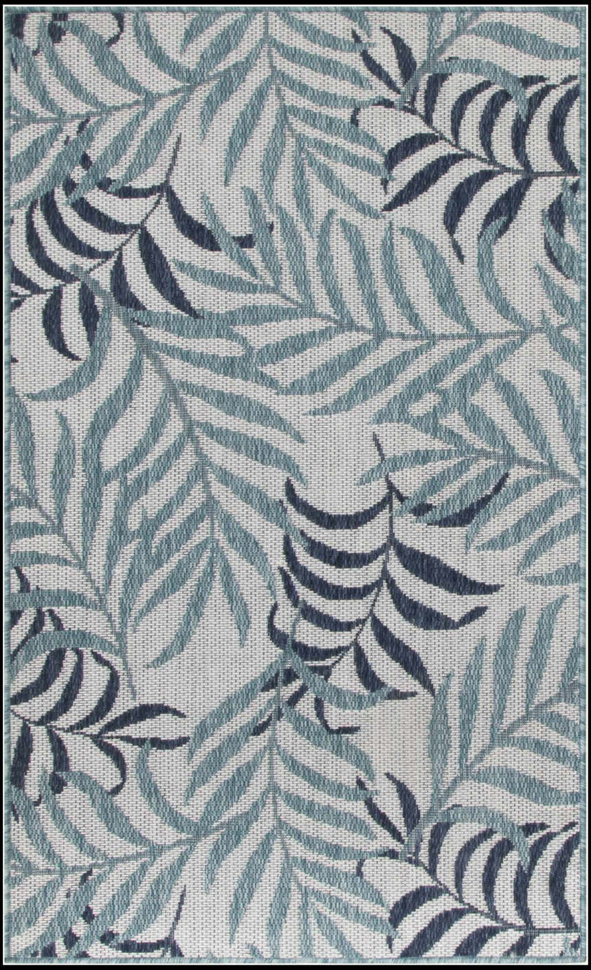 Close-up of Nourison Garden Oasis Blue Tropical Area Rug featuring a leafy light and dark blue pattern.