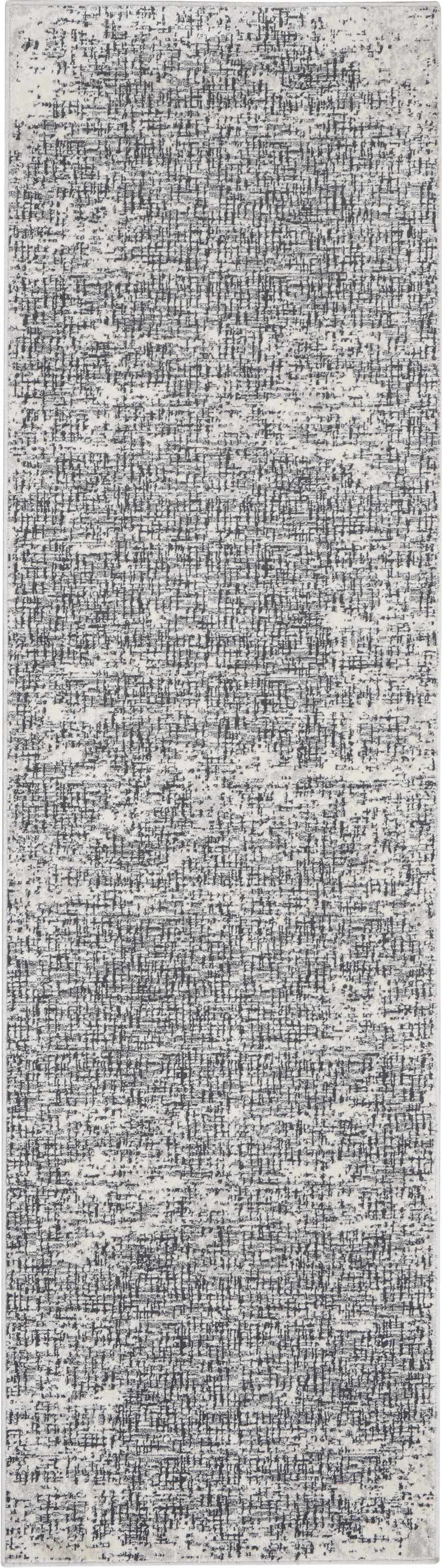 Close-up of Calvin Klein CK970 Vapor Ivory Black rug featuring a modern, textured design.