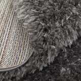 Close-up of the Feizy Darian Modern Solid Gray Area Rug showing its plush texture and backing. Fold