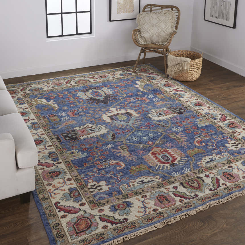 Living room scene with Feizy Beall Traditional Oriental rug in blue and red, white sofa, and natural wood accents. Roomscene-Rectangle