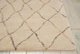 Close-up of the Barclay Butera Intermix Sand area rug. Wool rug with a diamond trellis pattern in sandstone.
