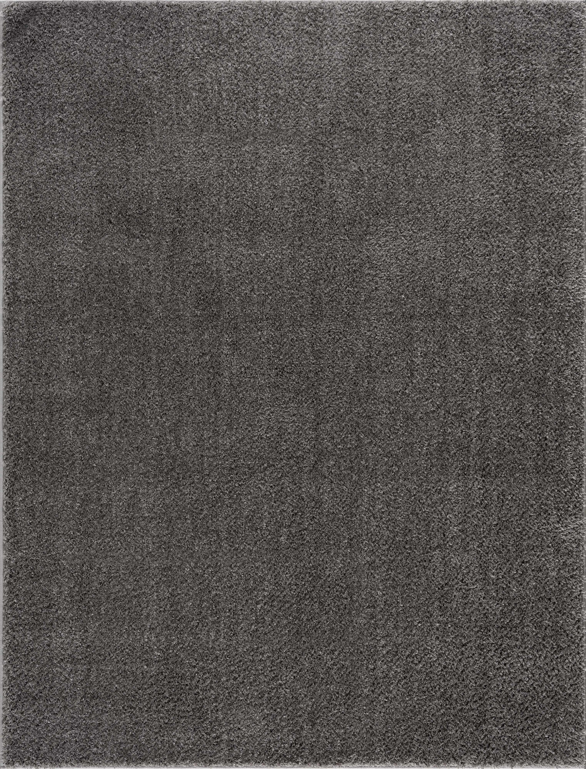 Close-up of the Judy Solid Dark Gray Washable Shag Rug, showing its soft texture and neutral gray color. Design-Rectangle