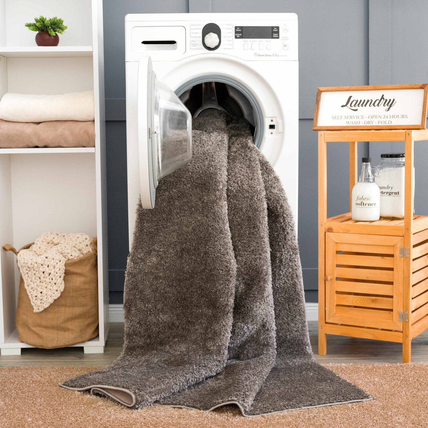 Laundry room scene with a Judy Solid Dark Gray Washable Shag Rug being washed in a front load washing machine. Washing-Machine