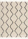 Close-up of the West End Plush Area Rug. Light beige shag rug with a charcoal geometric diamond pattern and fringe. Design-Rectangle