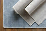 Close-up of the Bowstring Carpet - Clearance, showing cream and taupe colors and hand-loomed texture. Contemporary style rug. Styleshot
