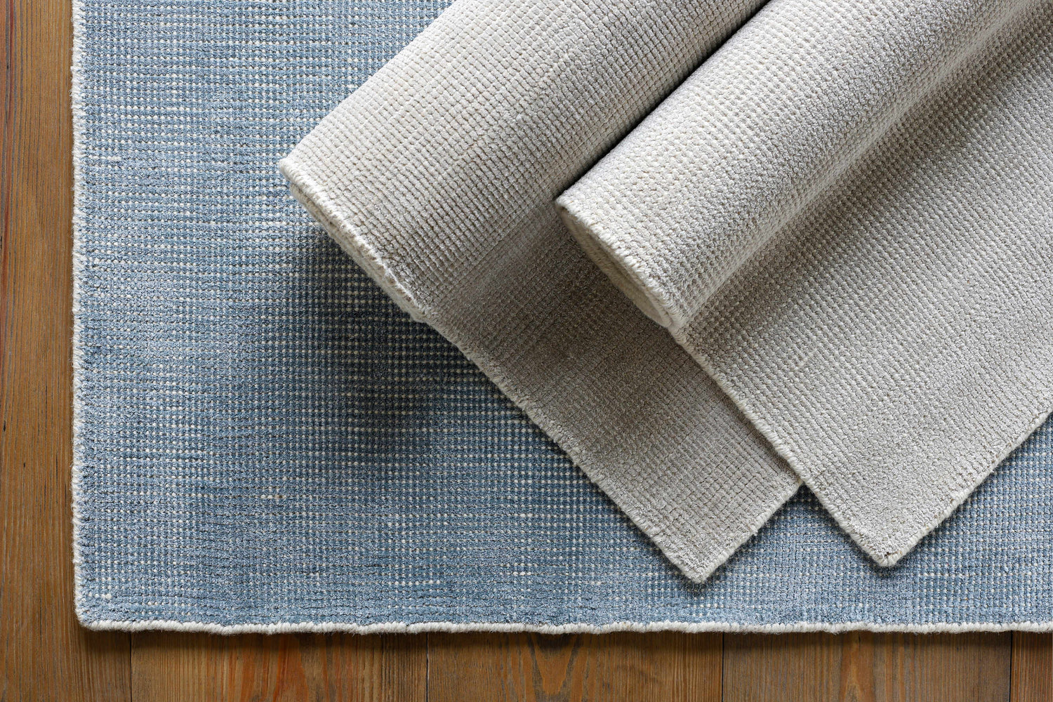 Close-up of the Bowstring Carpet - Clearance, showing cream and taupe colors and hand-loomed texture. Contemporary style rug. Styleshot