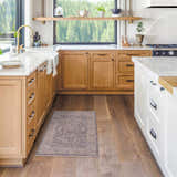 Farmhouse kitchen with wood cabinets and Binx Thick Luxe Statement Rug in brown, charcoal, and sage. Roomscene-Rectangle