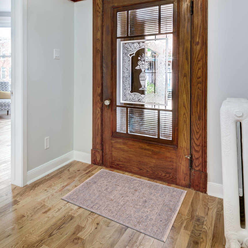 Entryway with Ayarn Thick Luxe Statement Rug in brown, charcoal, and sage. Traditional style with wood door and floors. Roomscene-Rectangle