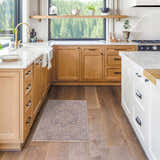 Farmhouse kitchen with wood cabinets and Deena Thick Luxe Area Rug in brown and teal tones on hardwood floor. Roomscene-Rectangle