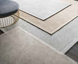 Close-up of taupe Westbend Area Rugs in varying shades, showcasing hand-loomed texture and subtle striped design. Styleshot