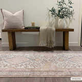 Entryway scene with a wood bench, and the Analu Non-Slip Washable Rug in brown, light blue, and tan. Farmhouse style. Roomscene-Runner