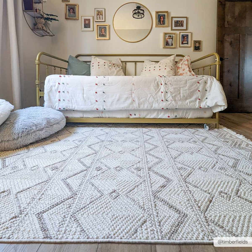 Kids room scene with a beige Armen Area Rug, gold daybed, and gallery wall. Farmhouse style. Roomscene-Rectangle