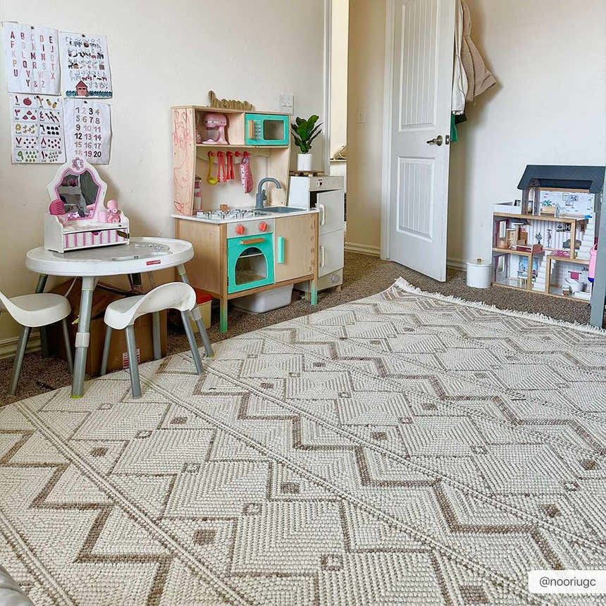 Kids room with Armen Area Rug in beige and gray, complementing a play kitchen and dollhouse. Roomscene-Rectangle