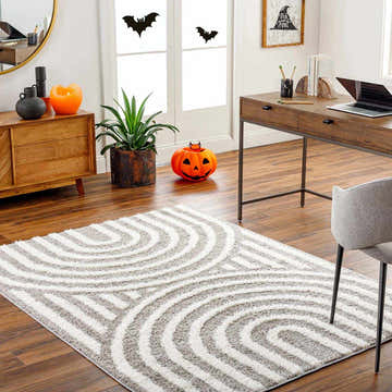 Home office with Arnel Brown Area Rug, wood desk, cabinet, and Halloween decorations. Roomscene-Rectangle