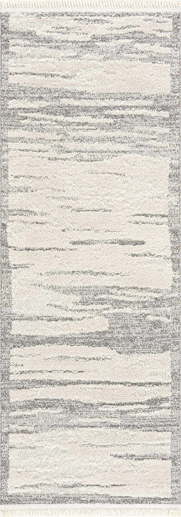 Close-up of Lave Bone & Taupe Area Rug. Neutral bone and taupe striped design with fringe. Contemporary style. Design-Runner