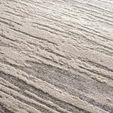 Close-up of the Lave Bone & Taupe Area Rug, showing bone and taupe striped pattern and textured, machine-woven construction. Texture