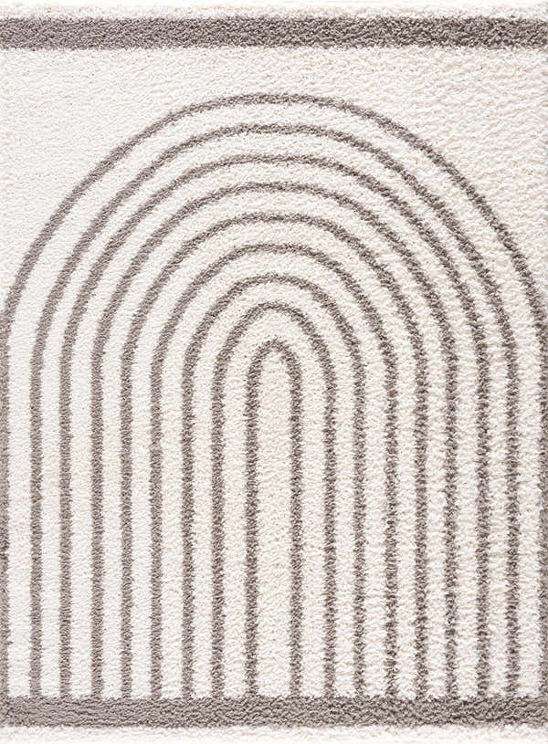 Close up of the Jola Taupe Area Rug showing a geometric rainbow pattern in taupe on a textured, off-white shag pile. Design-Rectangle-537