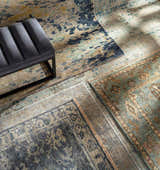 Close-up of hand-knotted Pias Area Rug - Clearance in beige, blue, and gray with a contemporary design and textured wool. Styleshot