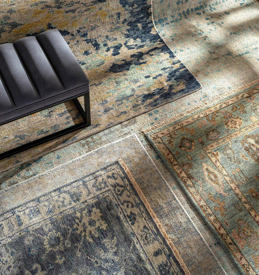 Close-up of hand-knotted Pias Area Rug - Clearance in beige, blue, and gray with a contemporary design and textured wool. Styleshot