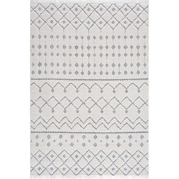 Close-up of the Ivory Gray Beil Textured Trellis Fringe Area Rug, featuring a geometric Moroccan design and soft fringe. Design-Rectangle