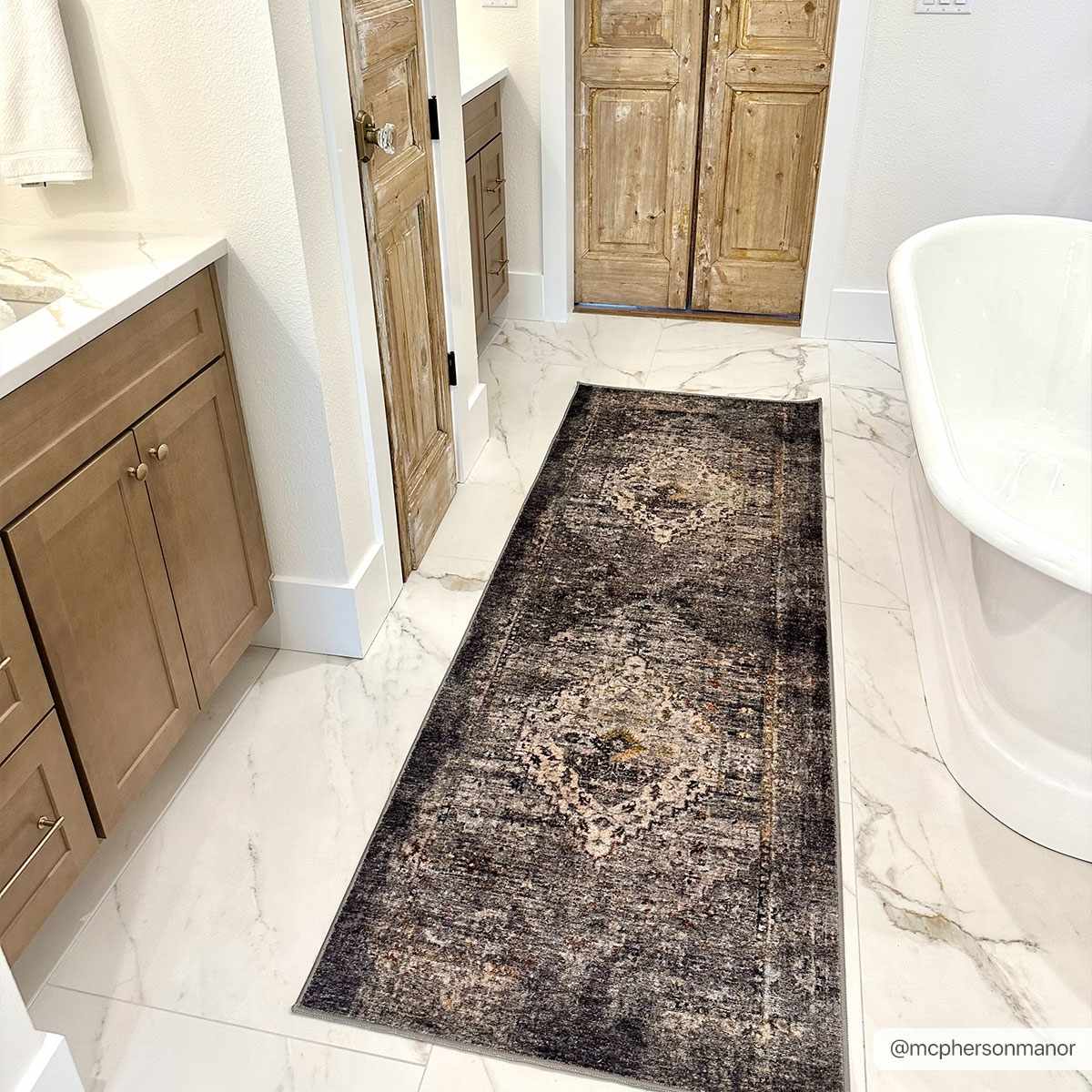 Bathroom scene with Basiad Washable Area Rug in dark purple. Farmhouse style with marble floors and wood cabinets. Roomscene-Runner