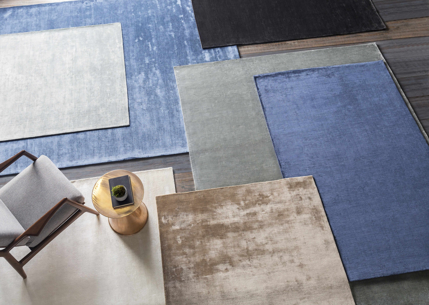 Overhead view of Rhodesdale Area Rug in brown, blue, gray, and white colors. Contemporary style, hand-loomed viscose texture. Styleshot