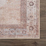 Close-up of the Analu Non-Slip Washable Rug. Features a traditional oriental pattern in brown, tan, and light blue hues. Swatch
