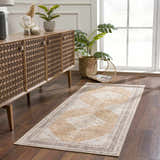 Entryway with a light brown Albas Washable Area Rug, wood console table, plants, and dark wood floors. Roomscene-Runner