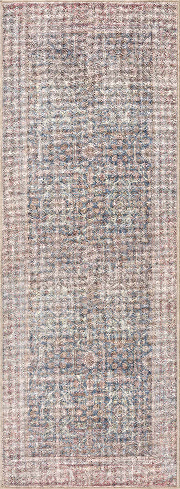 Close-up of Avel Washable Area Rug. Beige, blue, and burgundy traditional vintage pattern. Machine woven polyester rug. Design-Runner