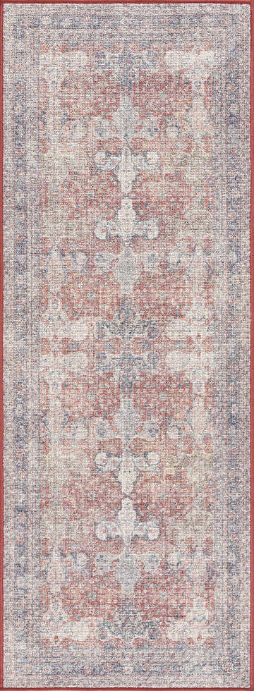 Close-up of the Ambre Washable Area Rug. Persian-style rug in beige, blue, and burgundy with a machine-woven texture. Design-Runner