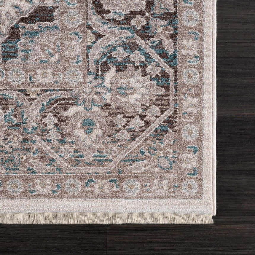 Close-up of the Baychester Area Rug showing its traditional oriental design, cream, brown, and denim colors, and fringe detail. Swatch