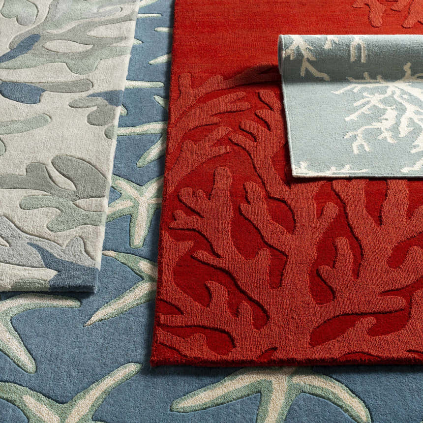Close-up of Carversville Ice Blue Botanical Wool Rug showing botanical, coral, and starfish patterns and textures. Styleshot