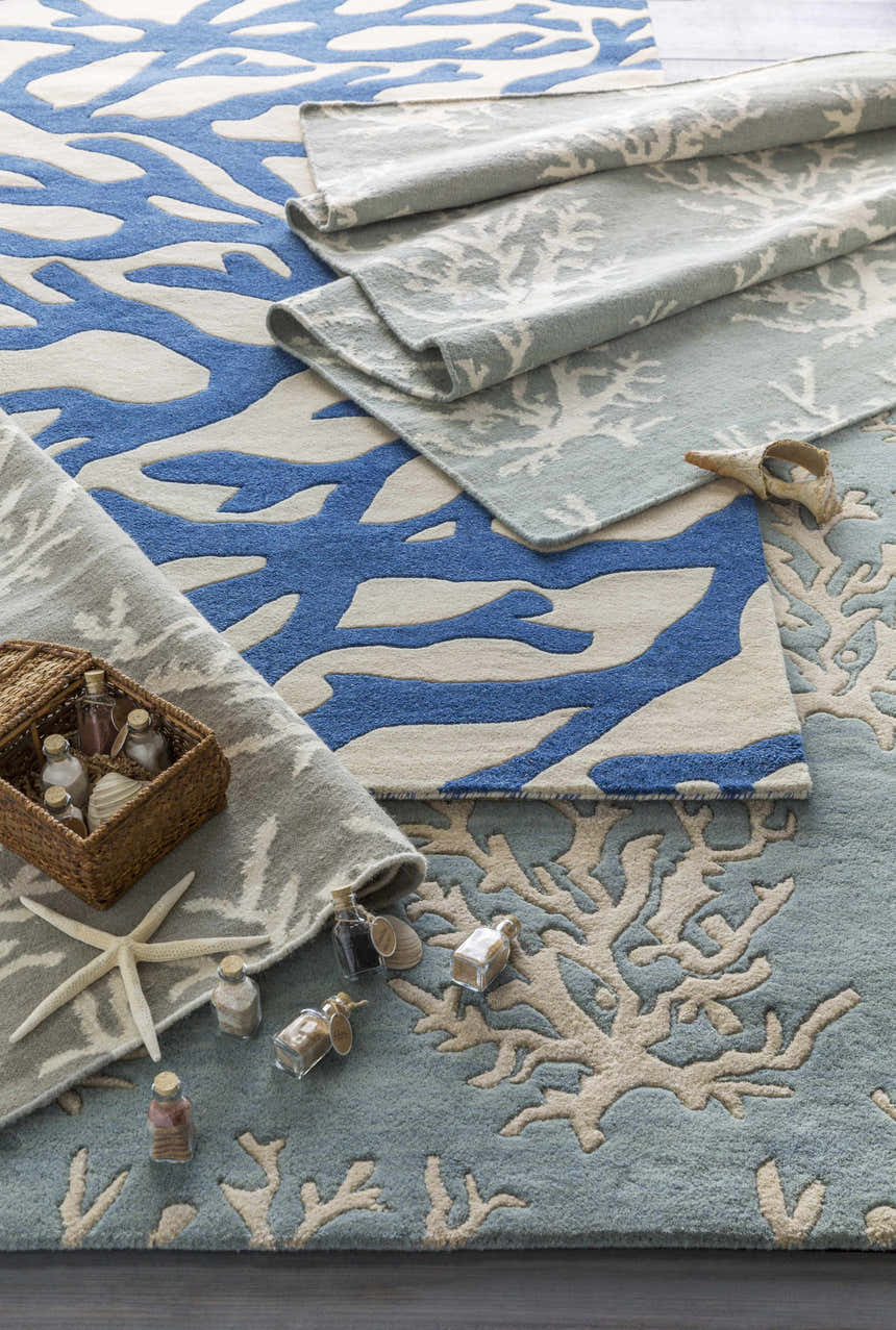 Close-up of Carversville Ice Blue Botanical Wool Rug showing ivory and blue coral-inspired pattern and wool texture. Styleshot